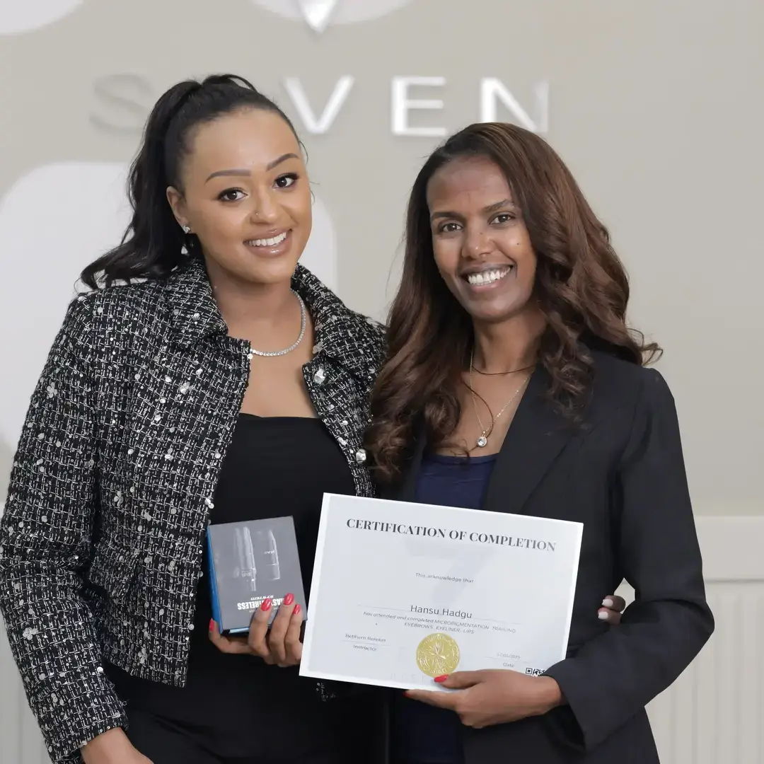 Permanent Makeup Certification at Seven Aesthetics: Teacher Betlehem Bereket with student Hanaa Haqqi, who received her certificate of completion and an award for graduating at the top of her class.